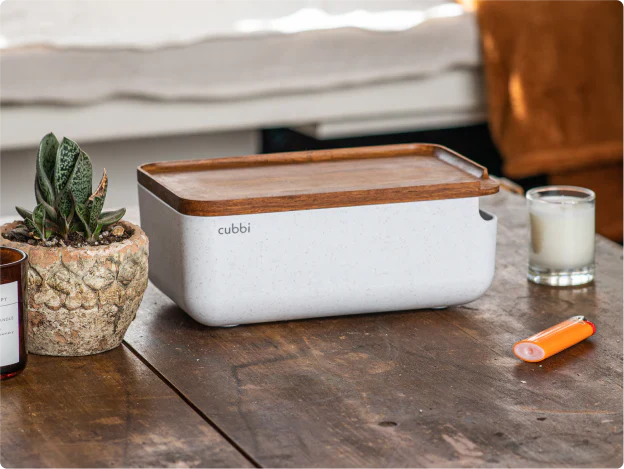 aesthetic looking cannabis stash box on the wooden table.