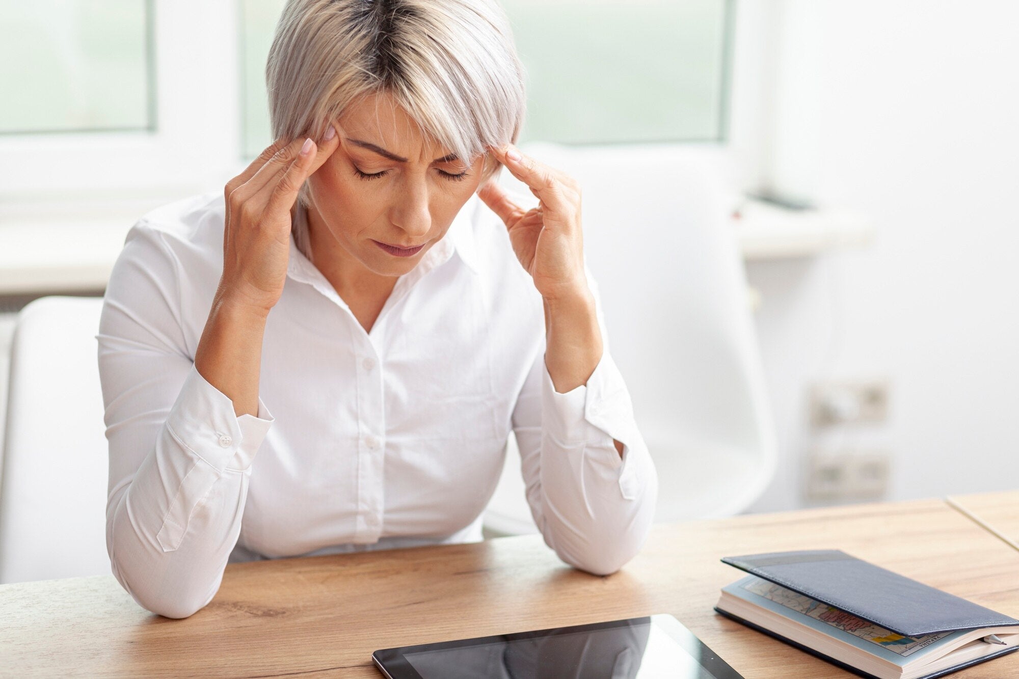 High angle business woman having some headache.