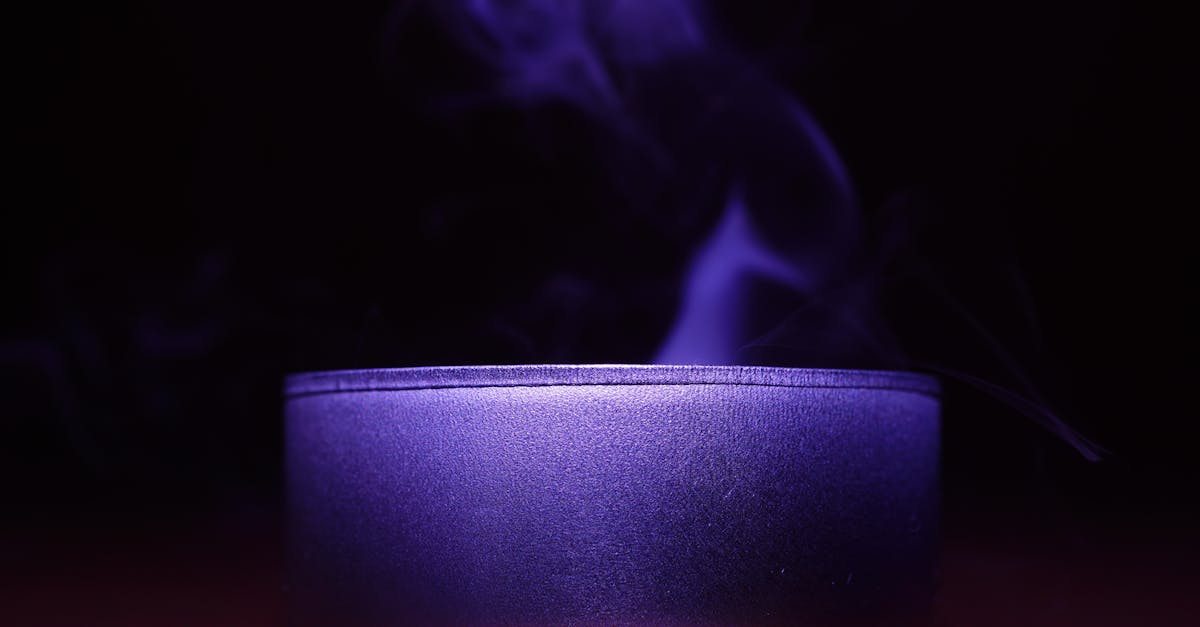 Close-up of Blue Candle Against Black Background.