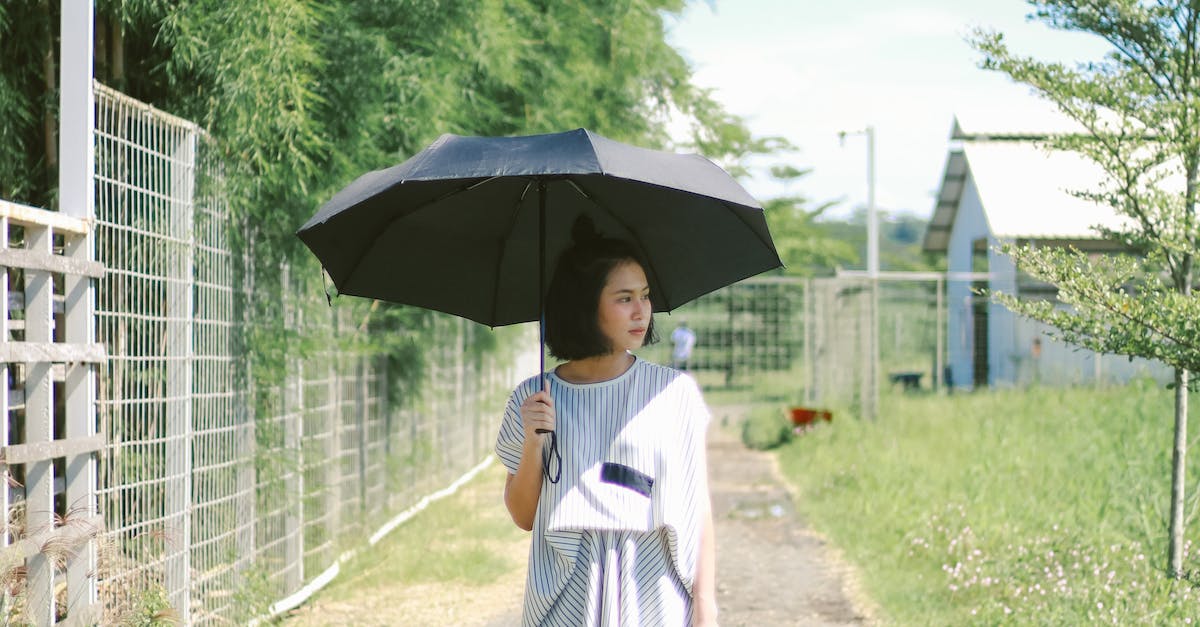 A photo of young woman with umbrella.